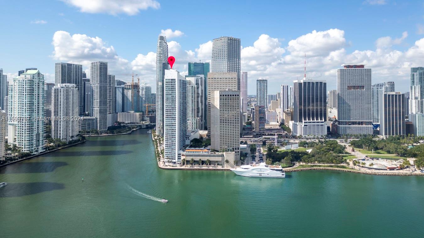 a view of water with tall building