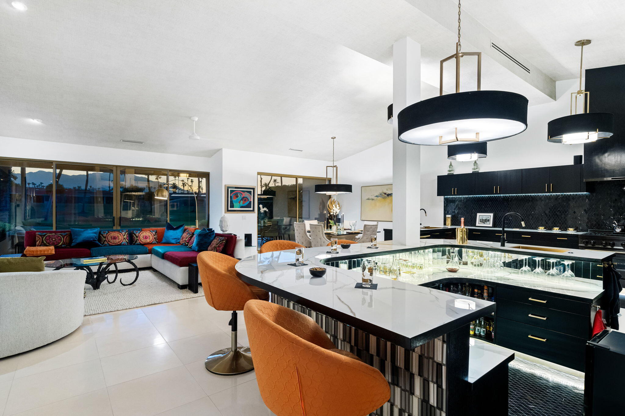 a kitchen with a table chairs and a fireplace