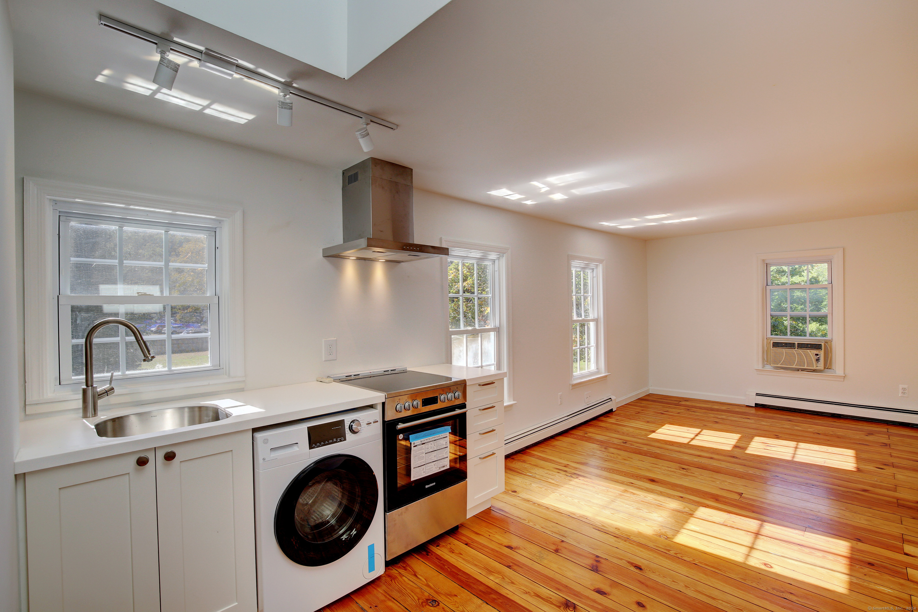 a view of livingroom with washer and dryer