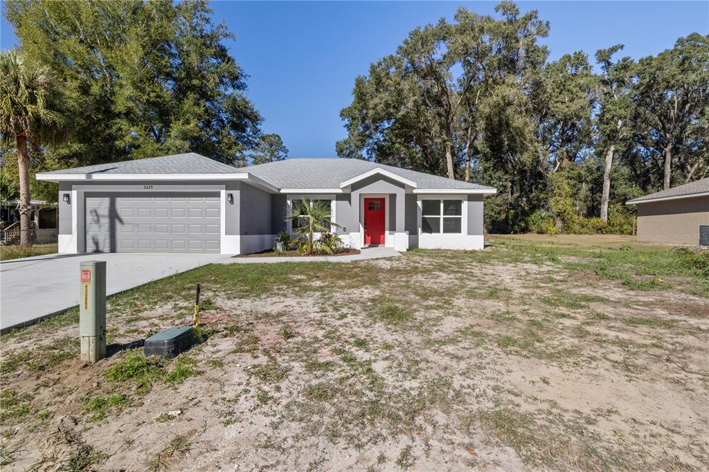 front view of a house with a yard