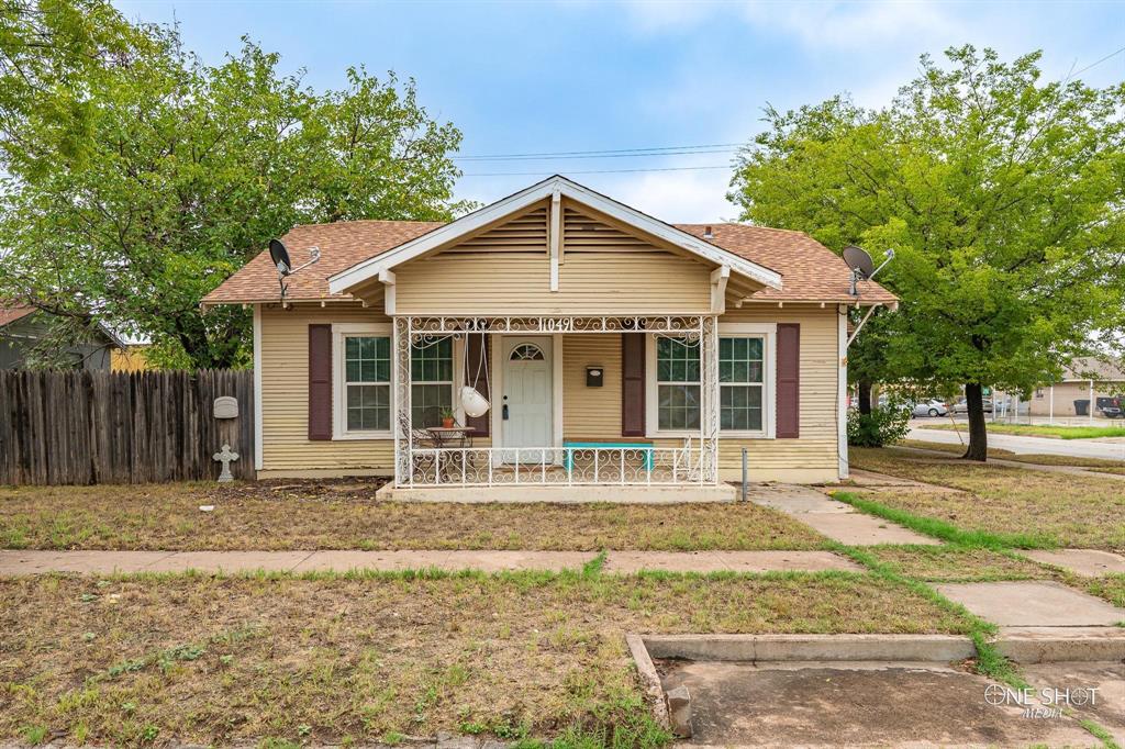 a house with trees in the background