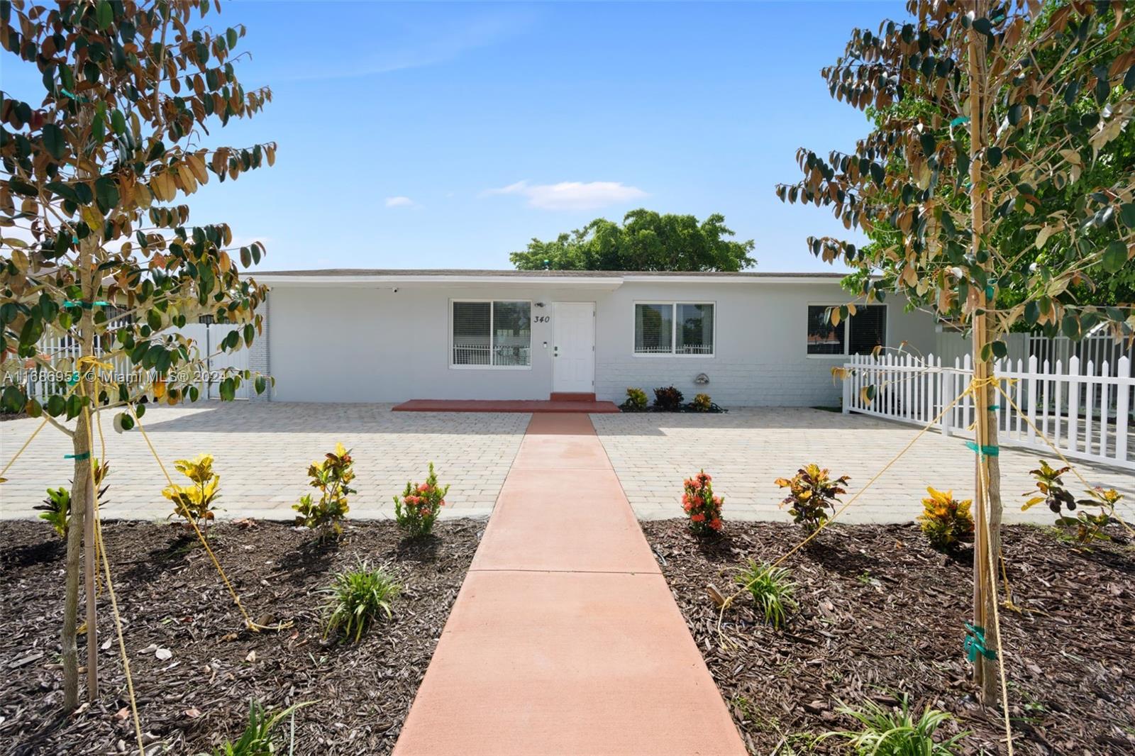 a view of house with swimming pool outdoor seating