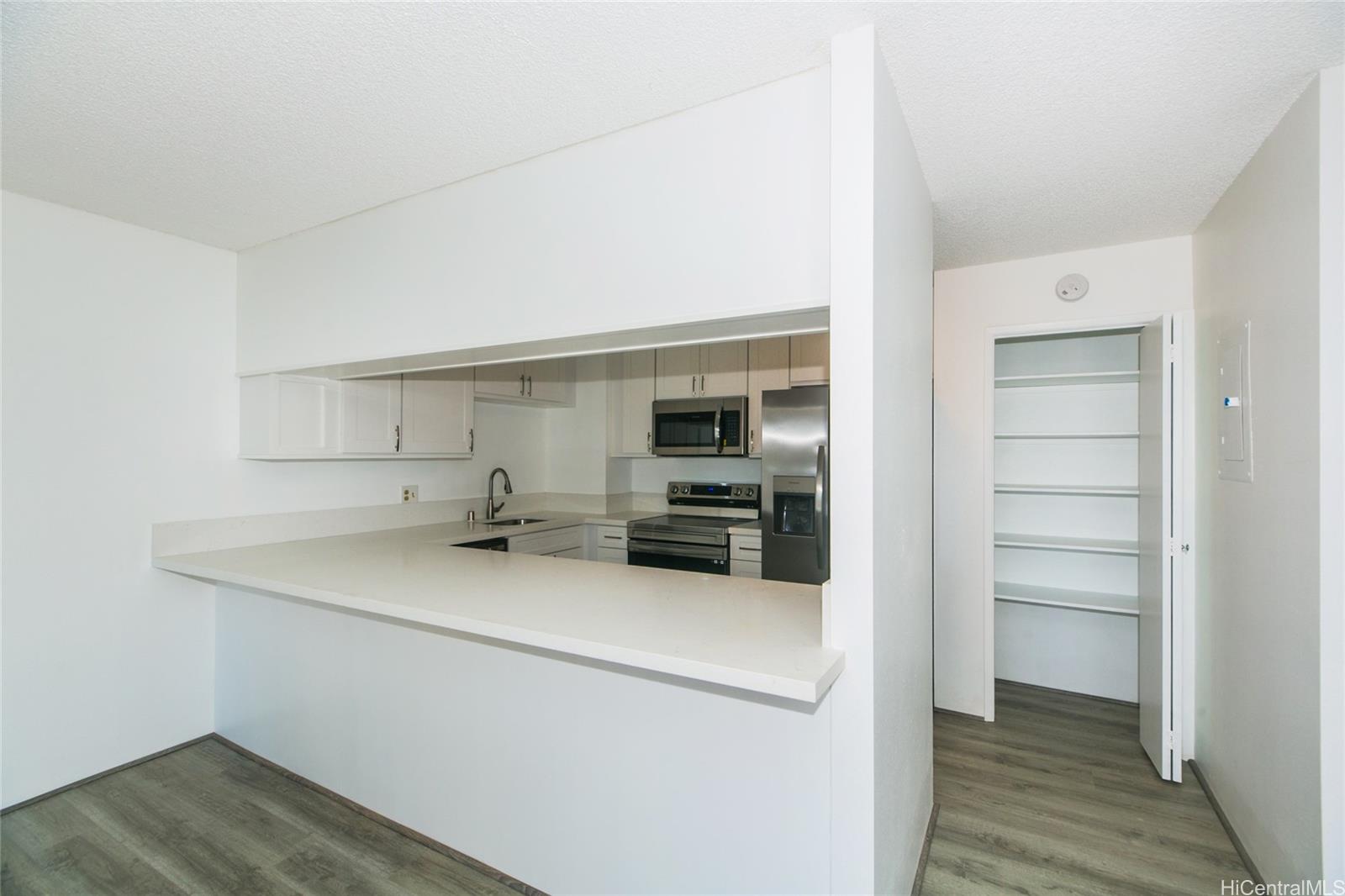 a view of cabinets and wooden floor