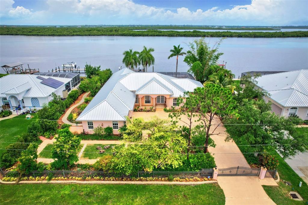 an aerial view of a house with a lake view