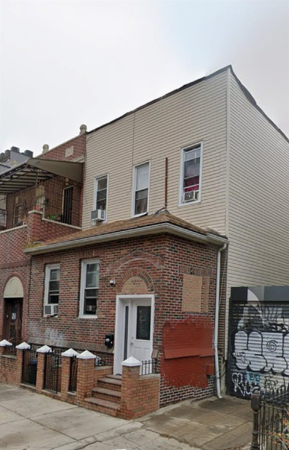 a front view of a house with parking space