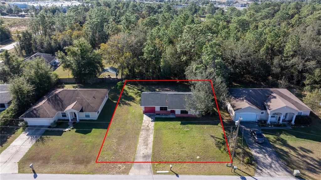 an aerial view of a house with swimming pool