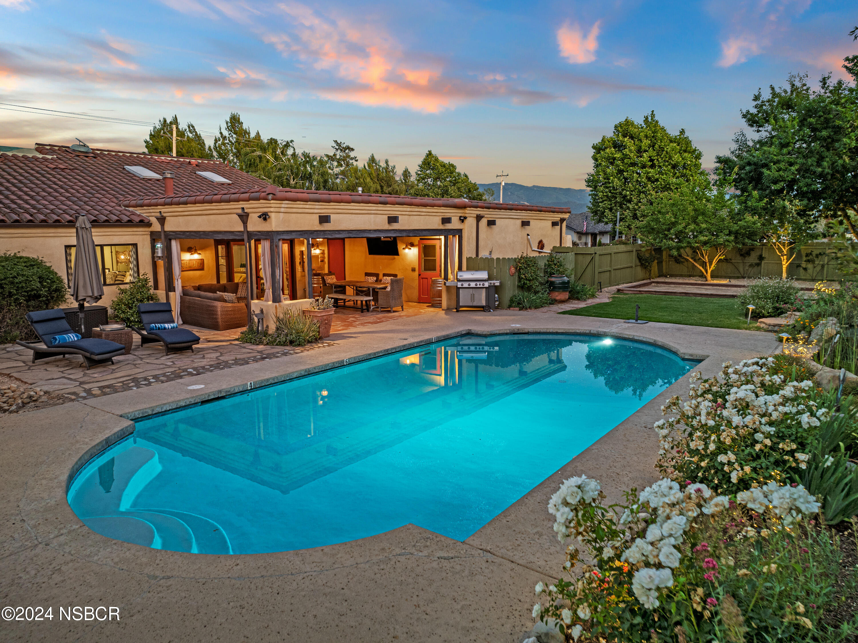 a view of a swimming pool with a patio