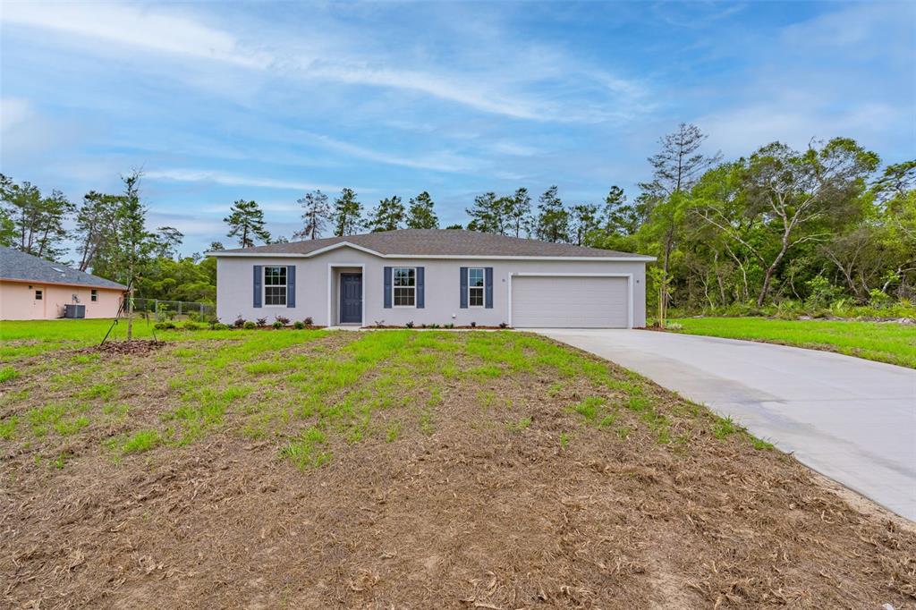 front view of a house with a yard