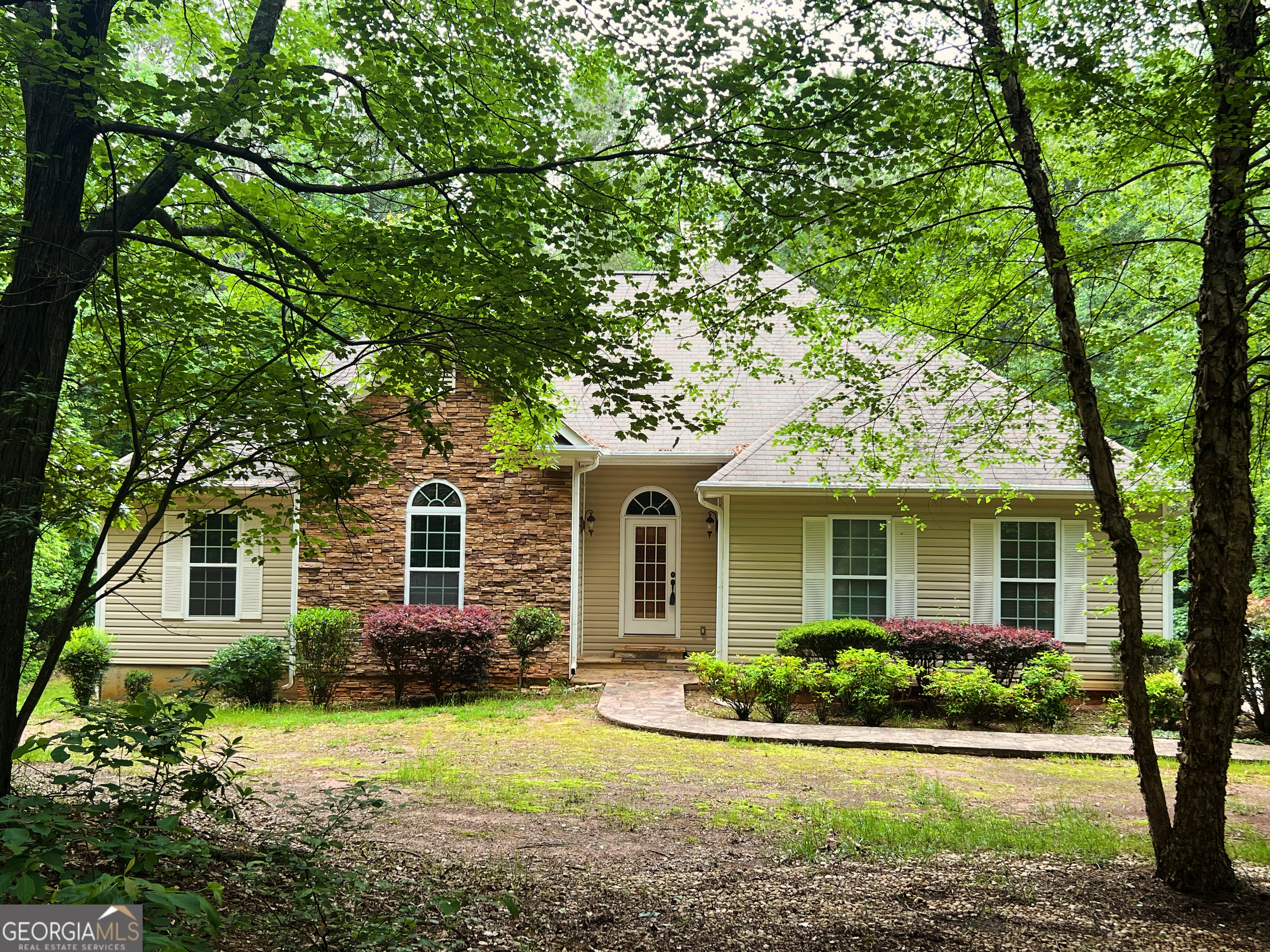 front view of a house with a yard