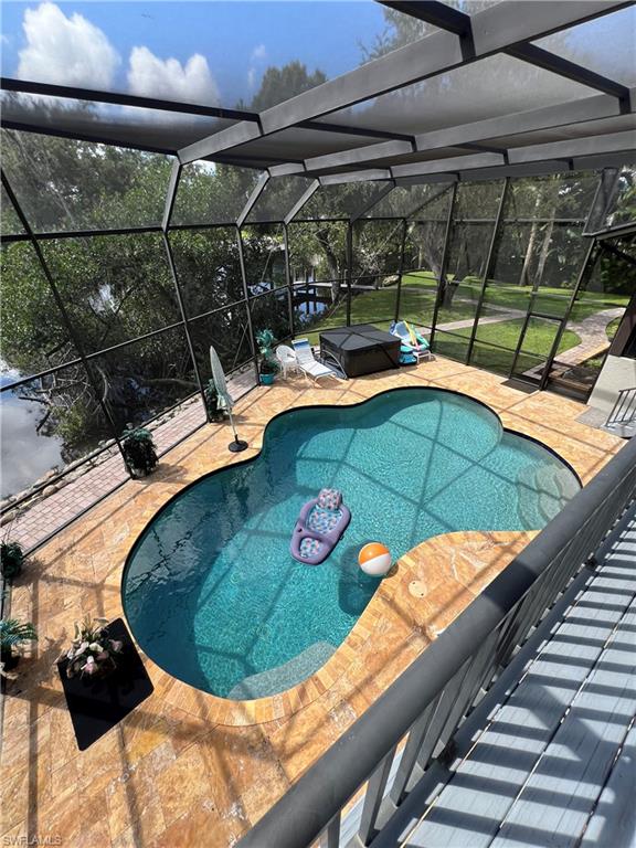 a view of a swimming pool with a patio