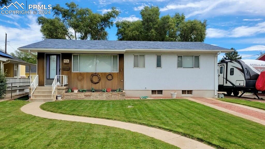 a front view of a house with garden