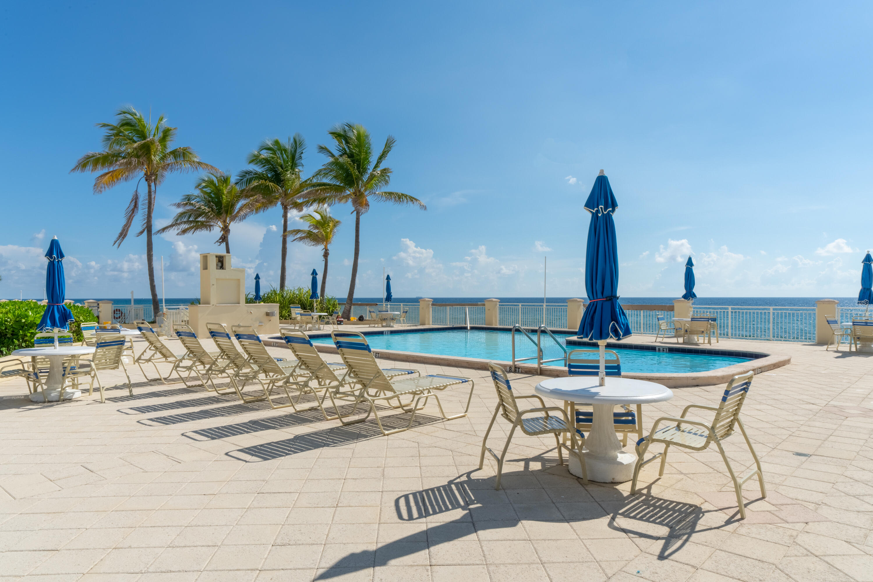 a view of a swimming pool with a lounge chair