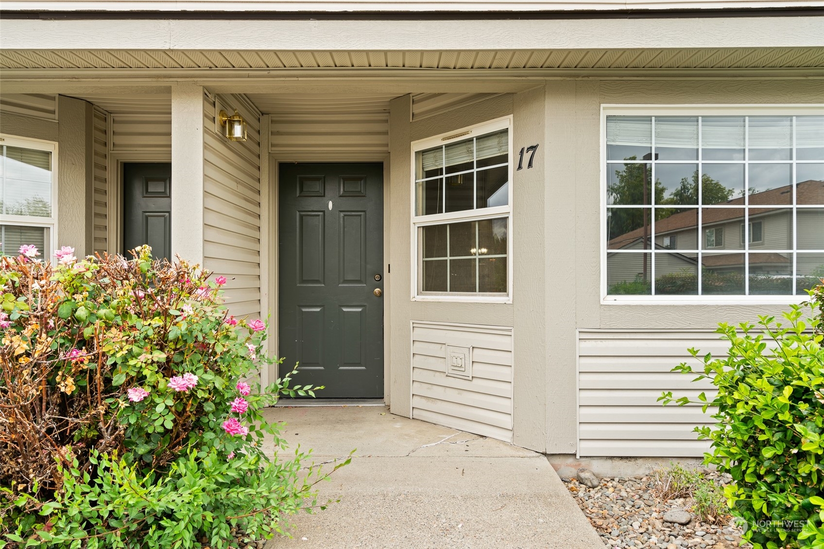 a front view of a house with a garage