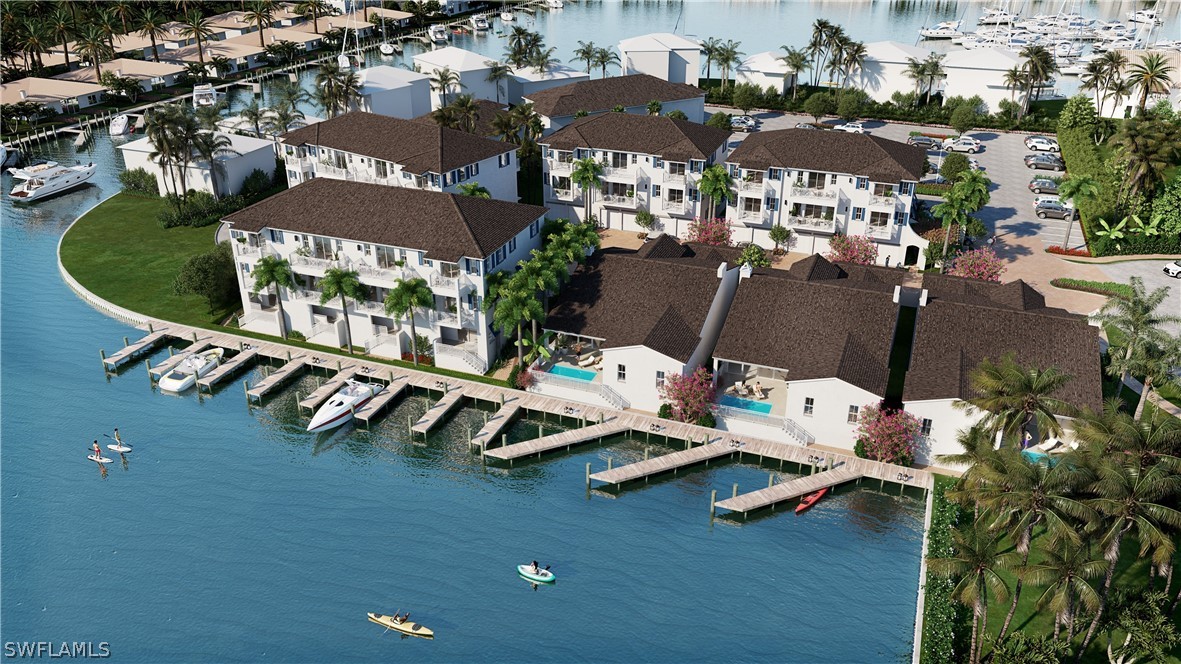 an aerial view of a house with yard swimming pool and outdoor seating