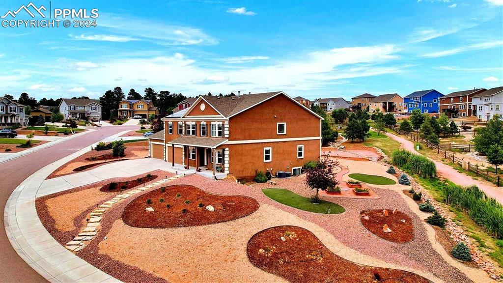 an aerial view of a house with outdoor space