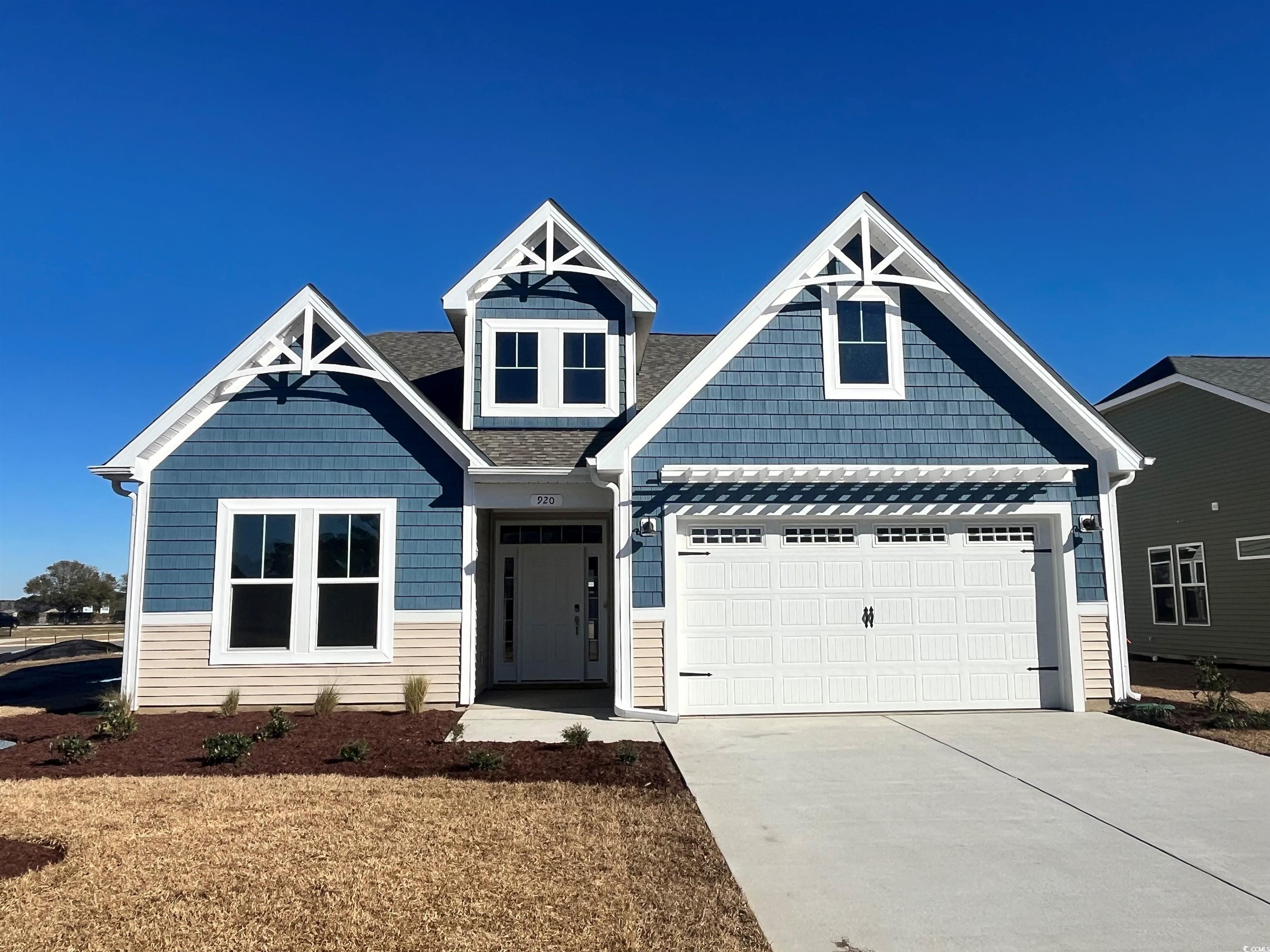 Craftsman inspired home featuring a garage