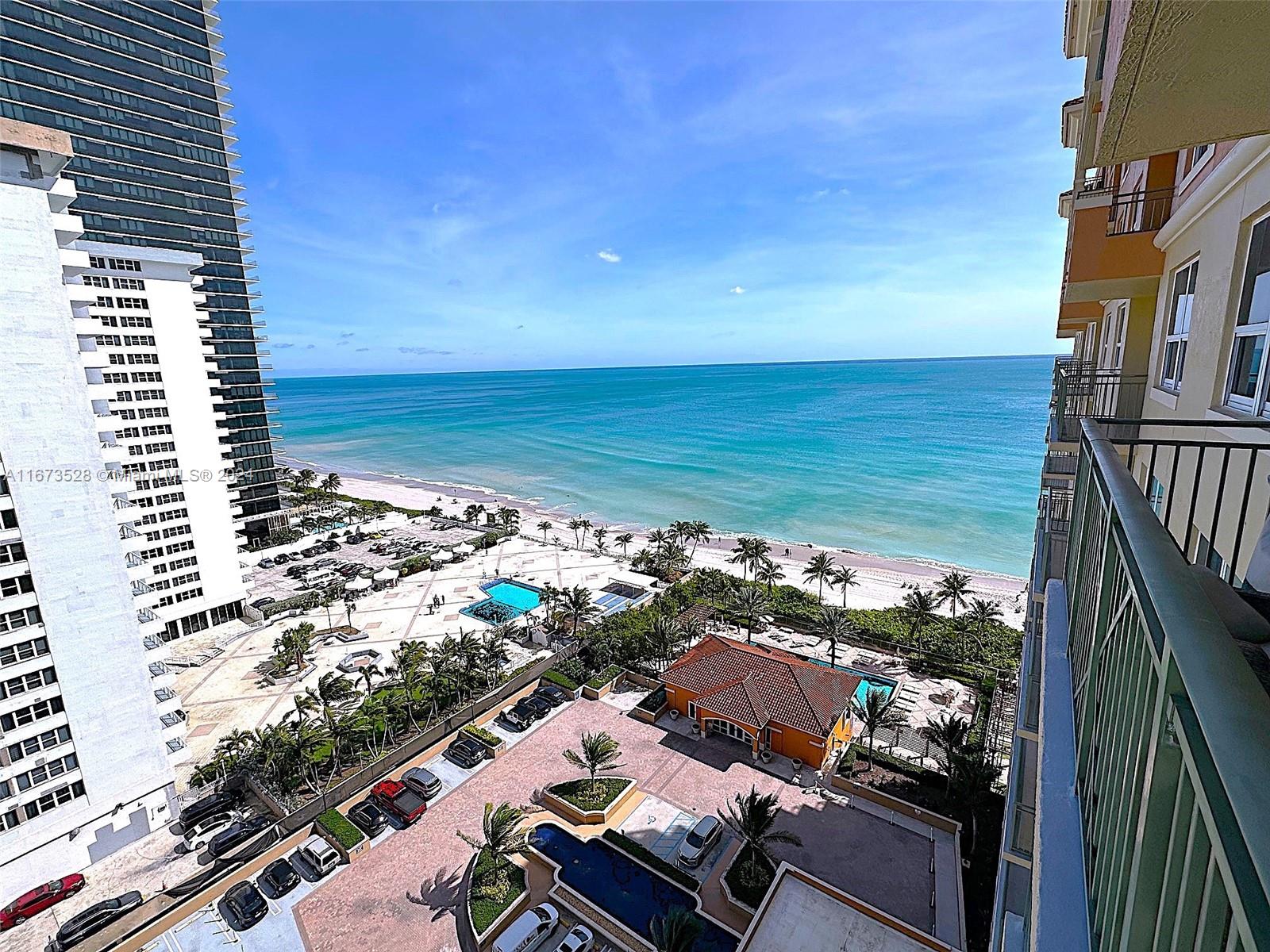 a view of roof deck with ocean view