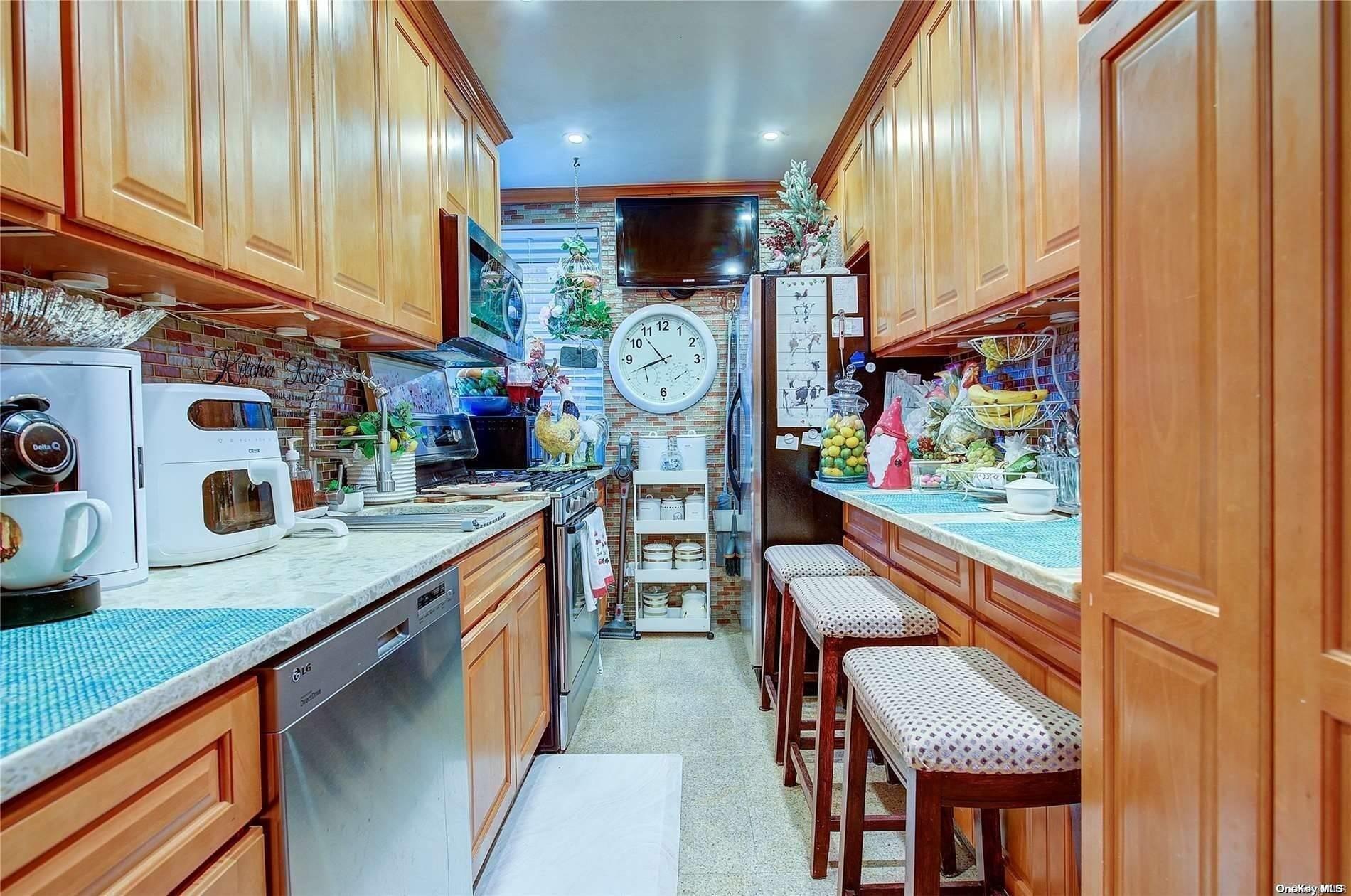 a kitchen with stainless steel appliances granite countertop sink stove and cabinets