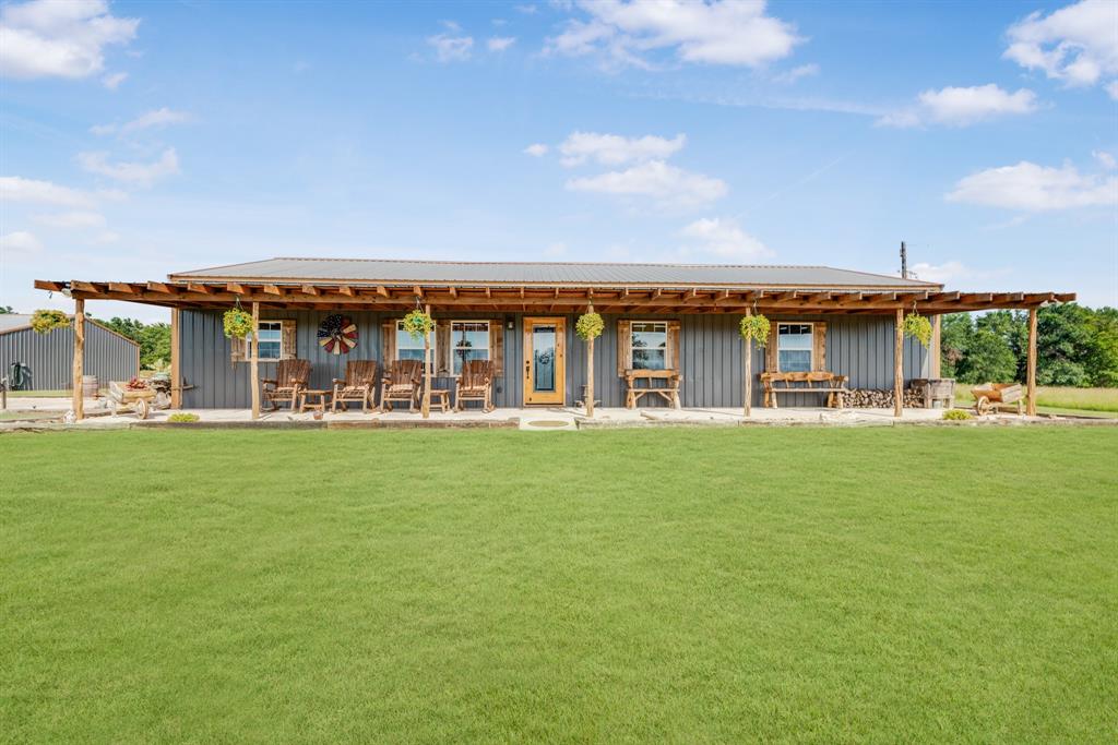 a view of building with outdoor space and swimming pool