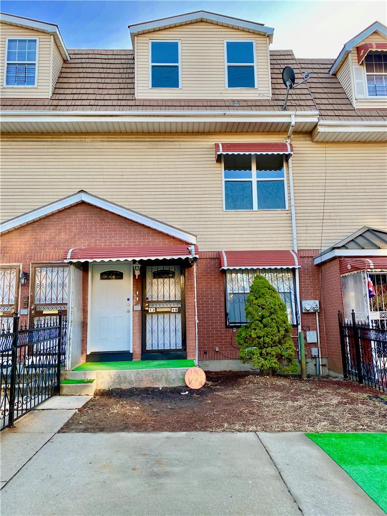 Townhome / multi-family property with covered porch