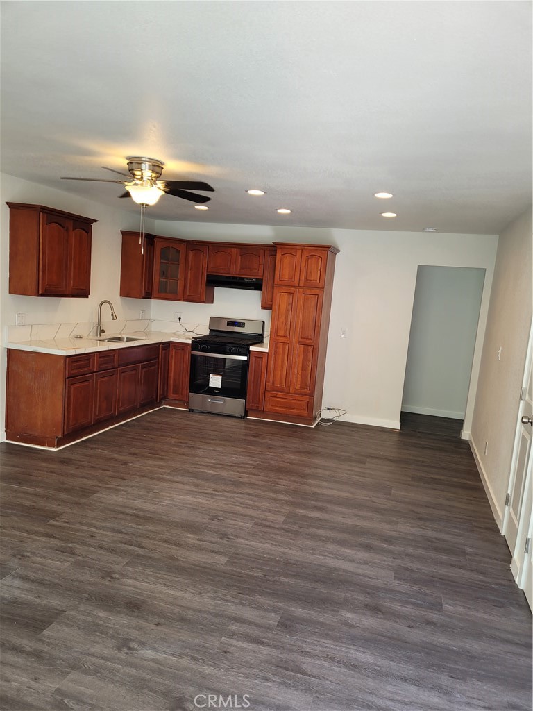 a view of kitchen and microwave with wooden floor