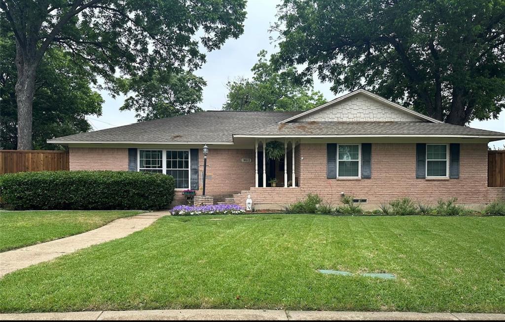 Ranch-style home with a front lawn