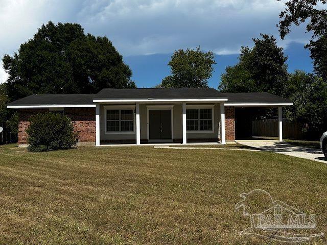 front view of a house with a garden