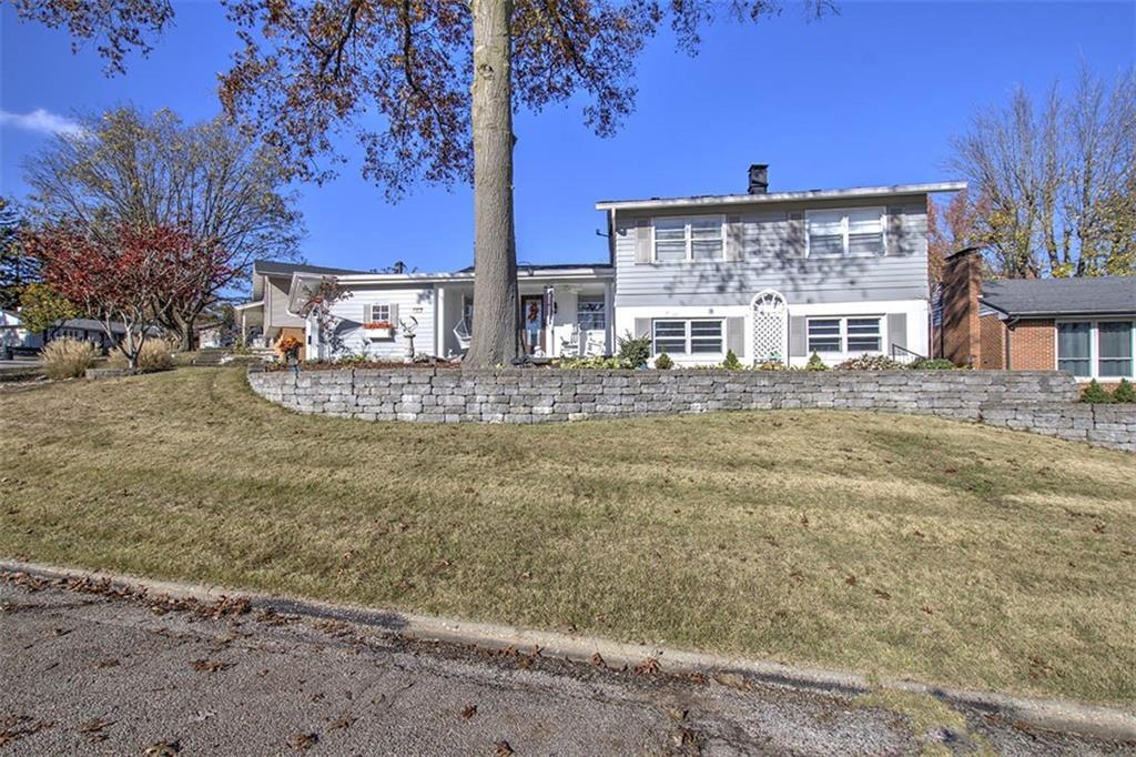 a view of a house with a yard