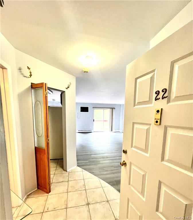 a bathroom with a shower and a mirror