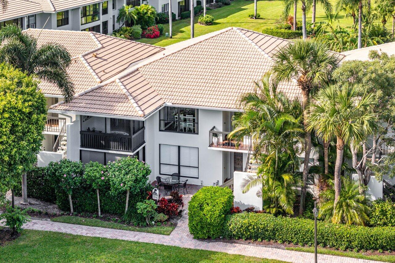 a view of a house with a yard and plants