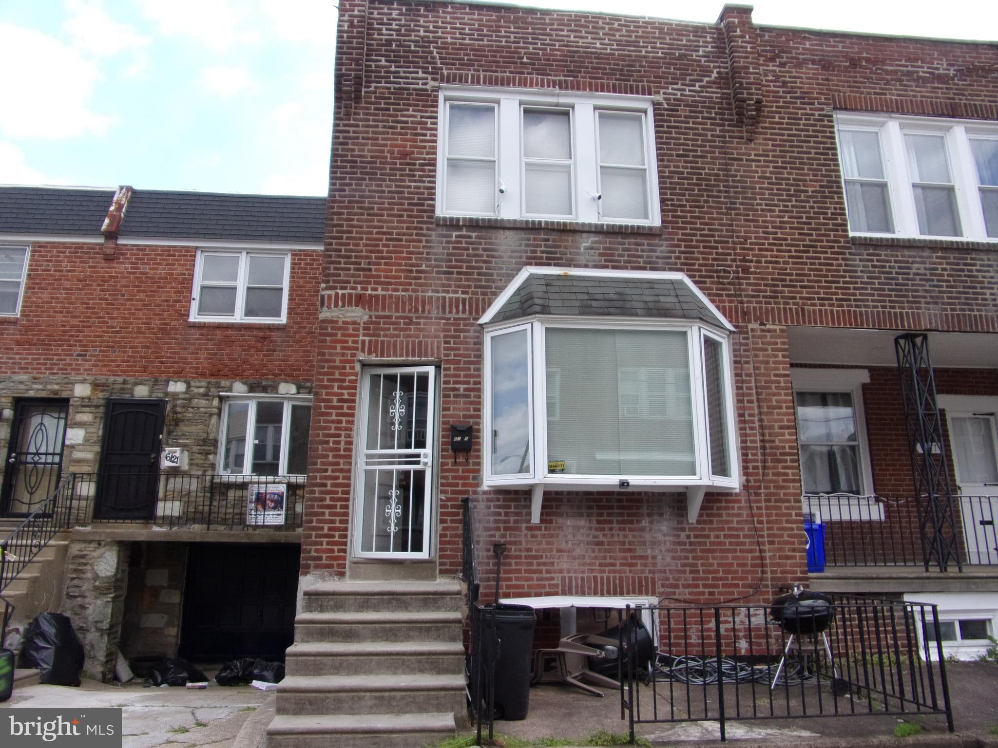 a front view of a house with a porch