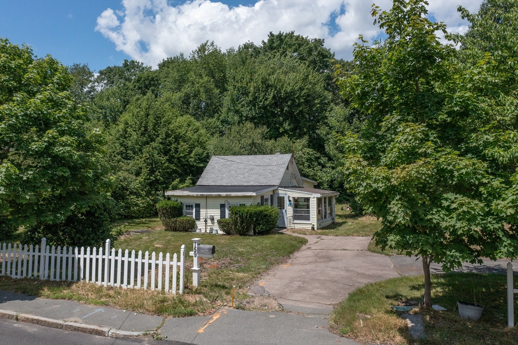 a house that has tree in front of it