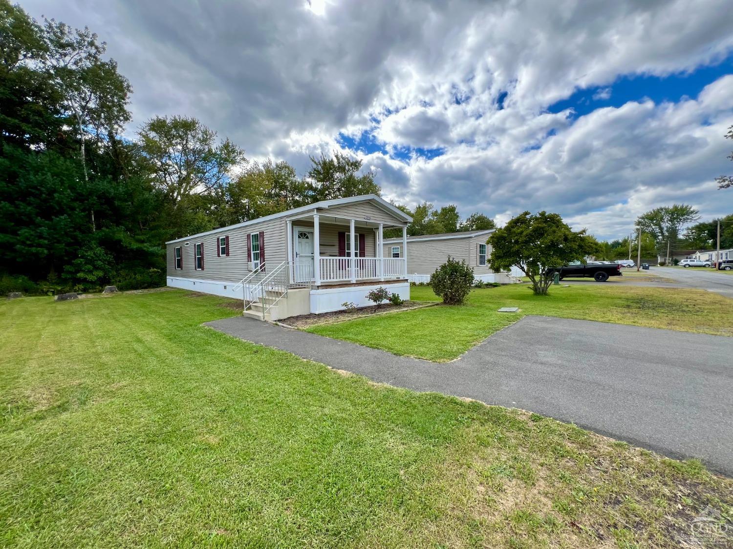 a view of a house with a big yard