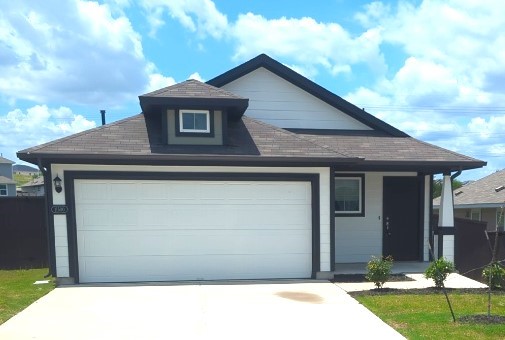 a front view of a house with garage