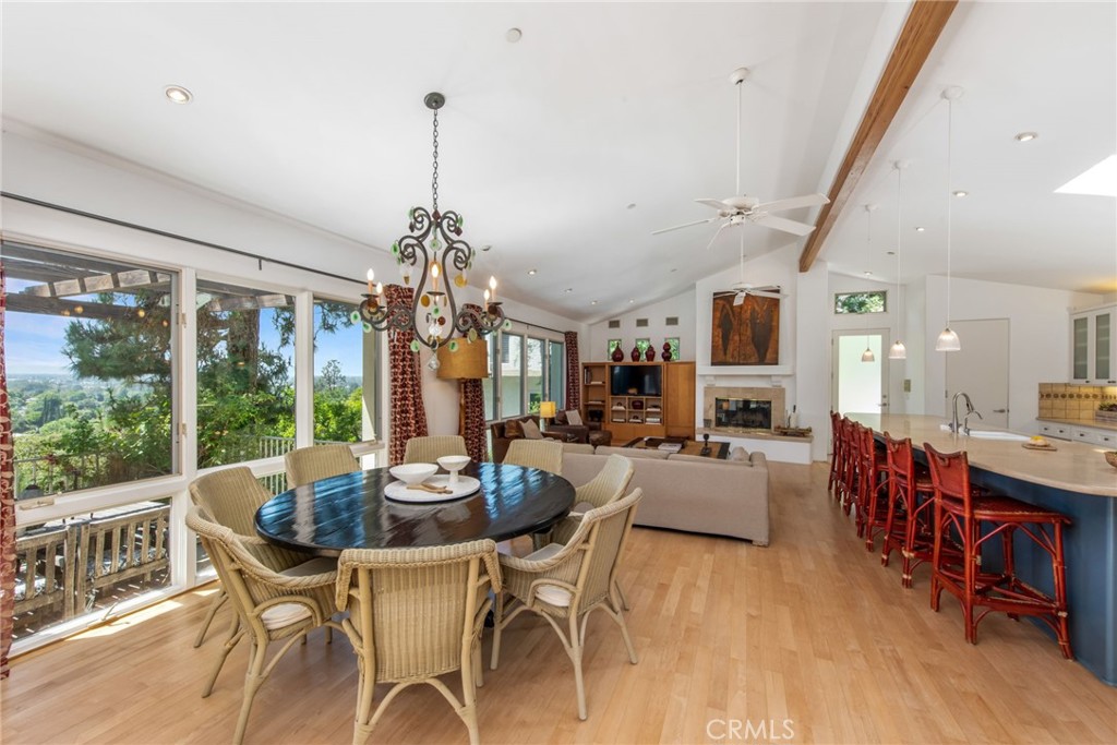 a dining room with furniture window and wooden floor