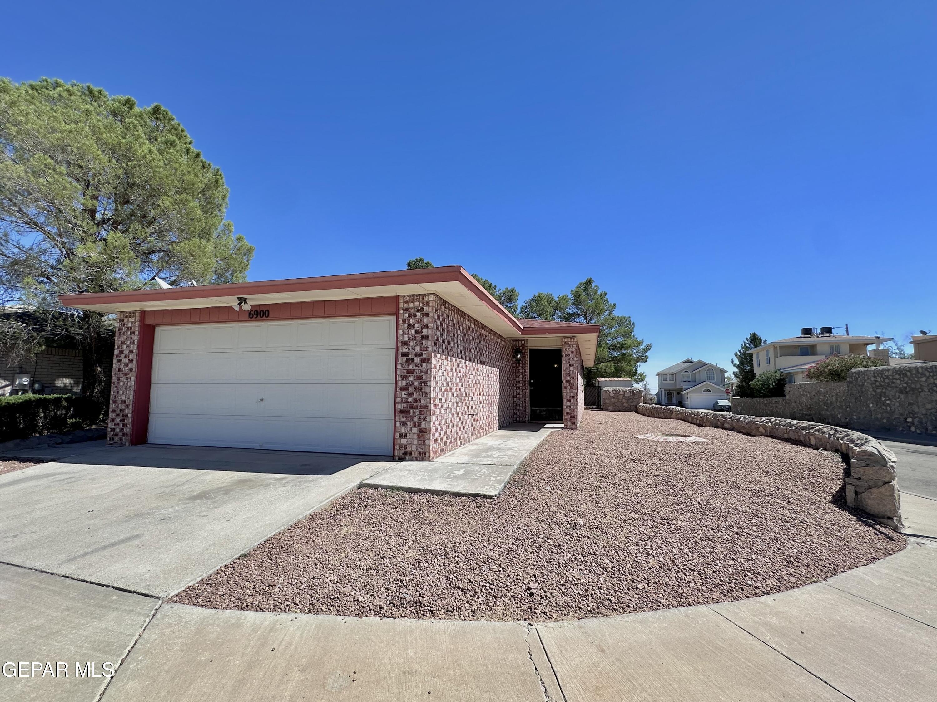 a front view of a house with a garage