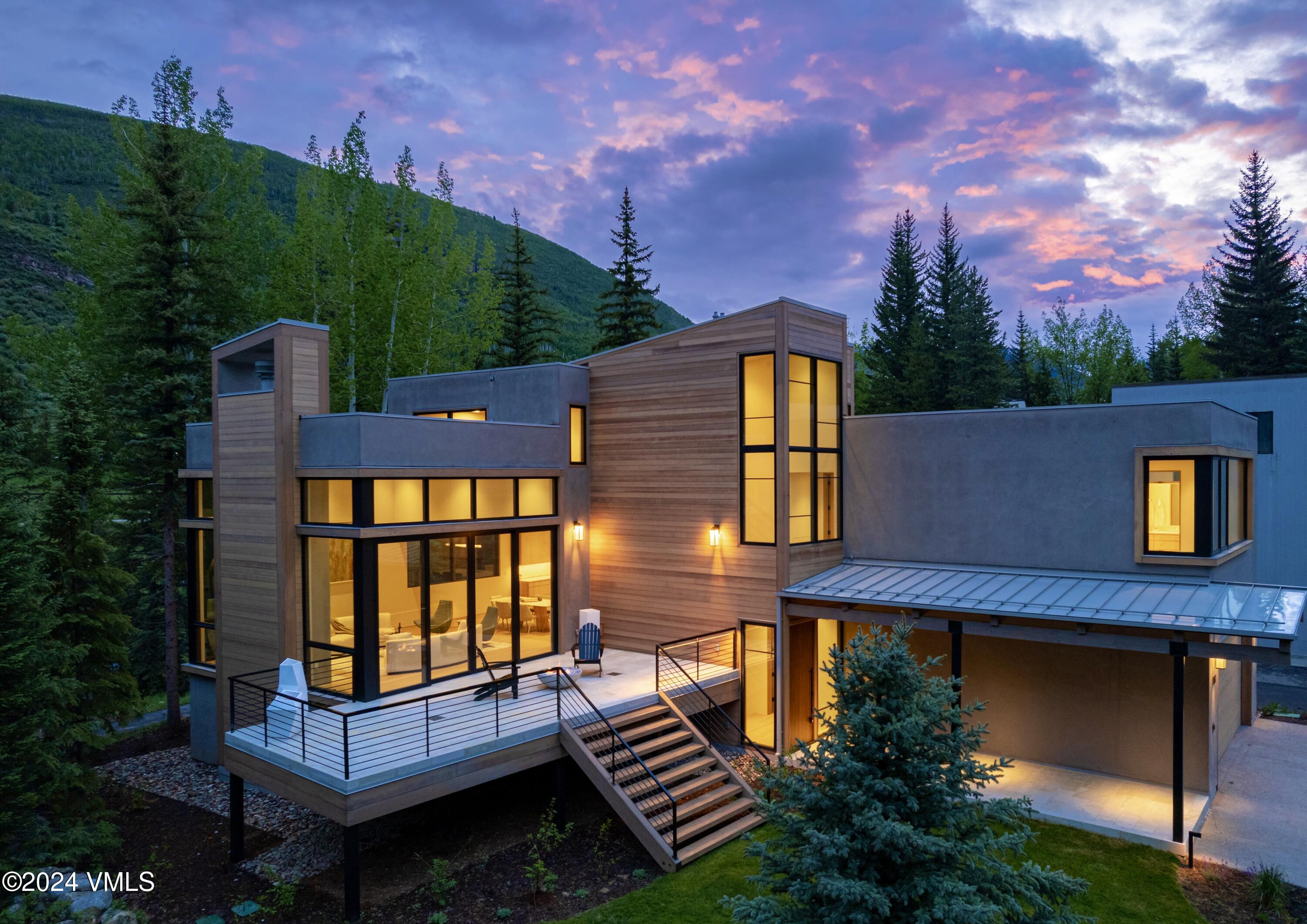 a backyard of a house with yard and outdoor seating