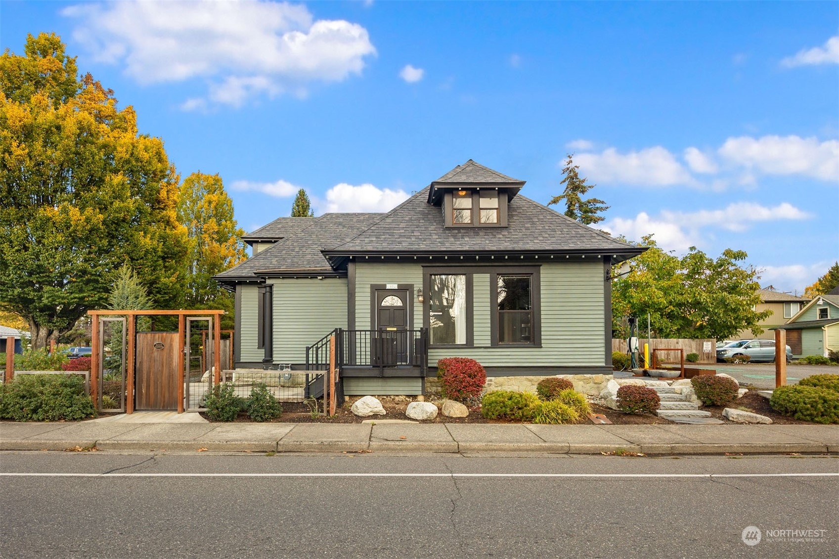 a front view of a house with a garden and entertaining space