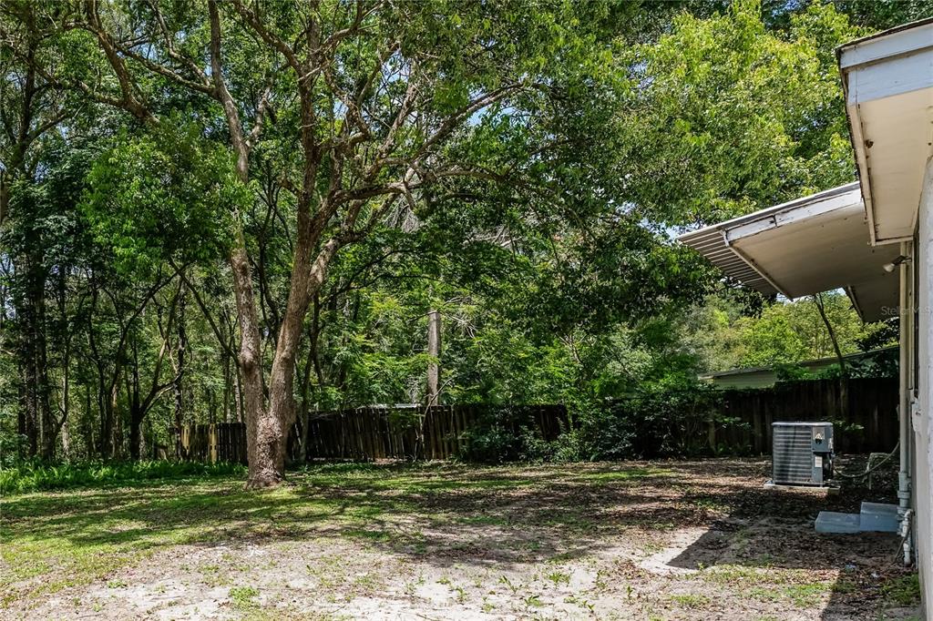 a backyard of a house with lots of green space