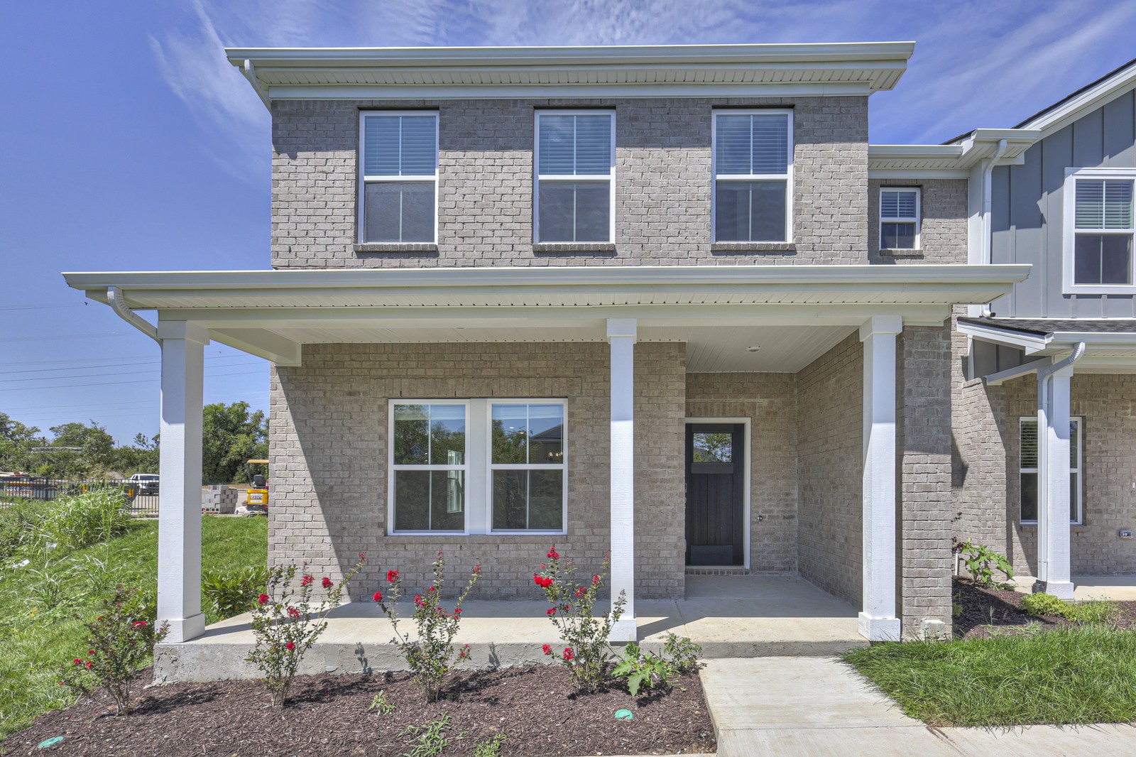 a front view of a house with a porch