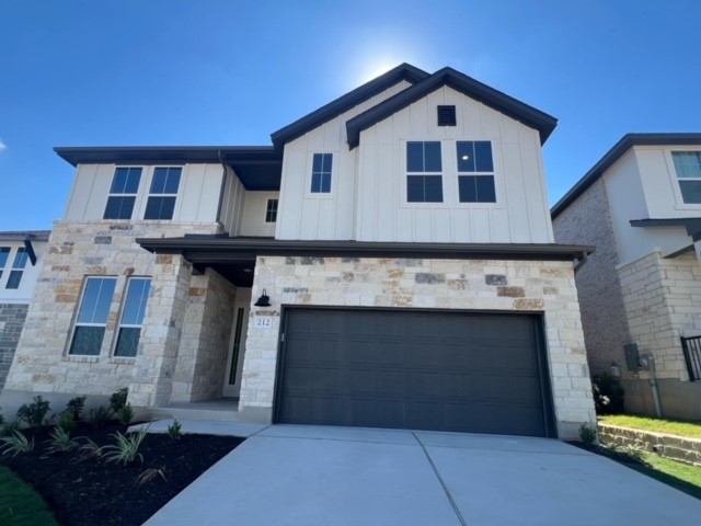 a front view of a house with a garage