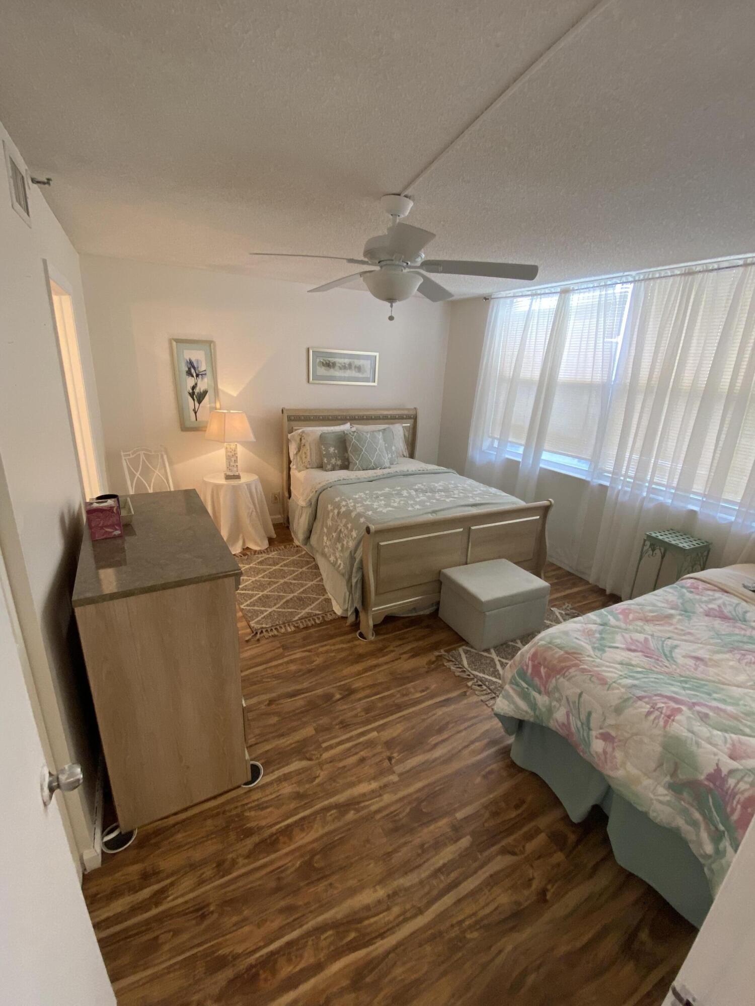 a bedroom with two beds and painted walls