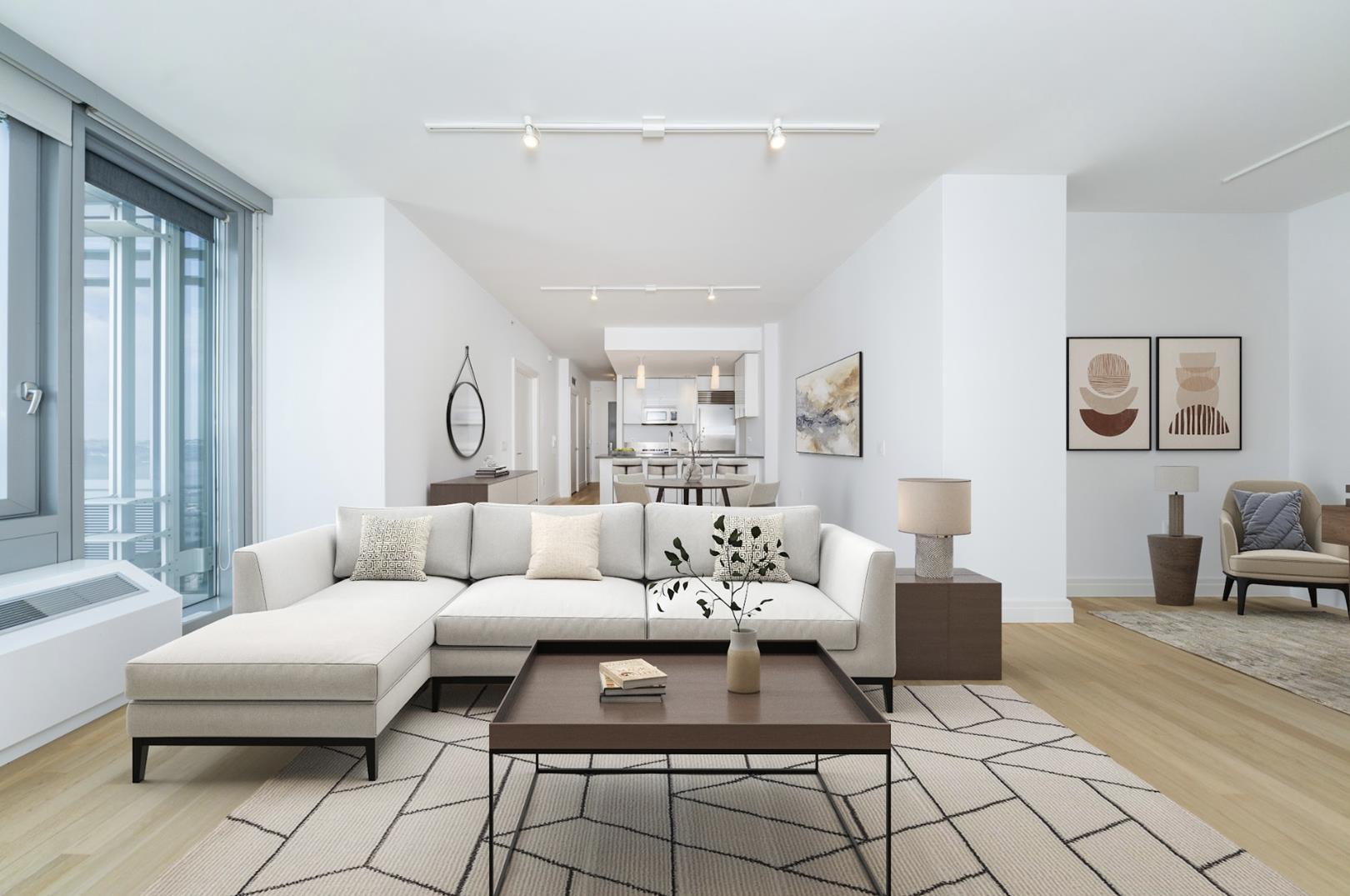 a living room with furniture and a potted plant