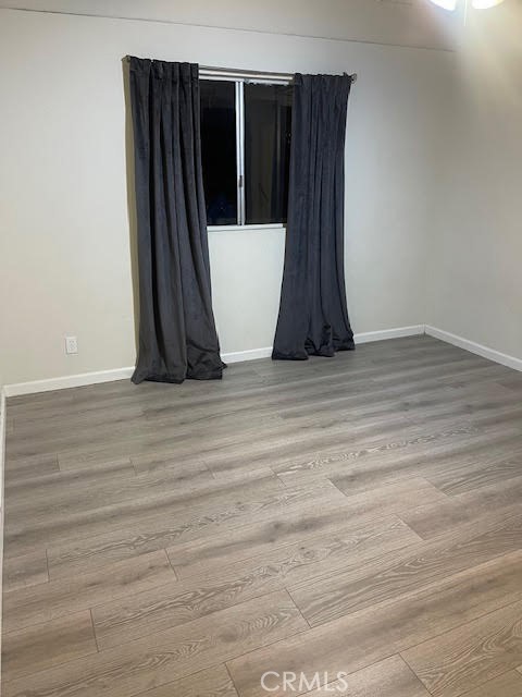 a view of a utility room with wooden floor