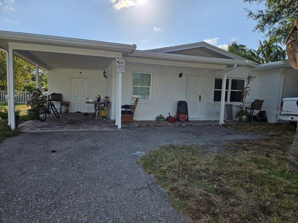 a view of house with couch and chairs