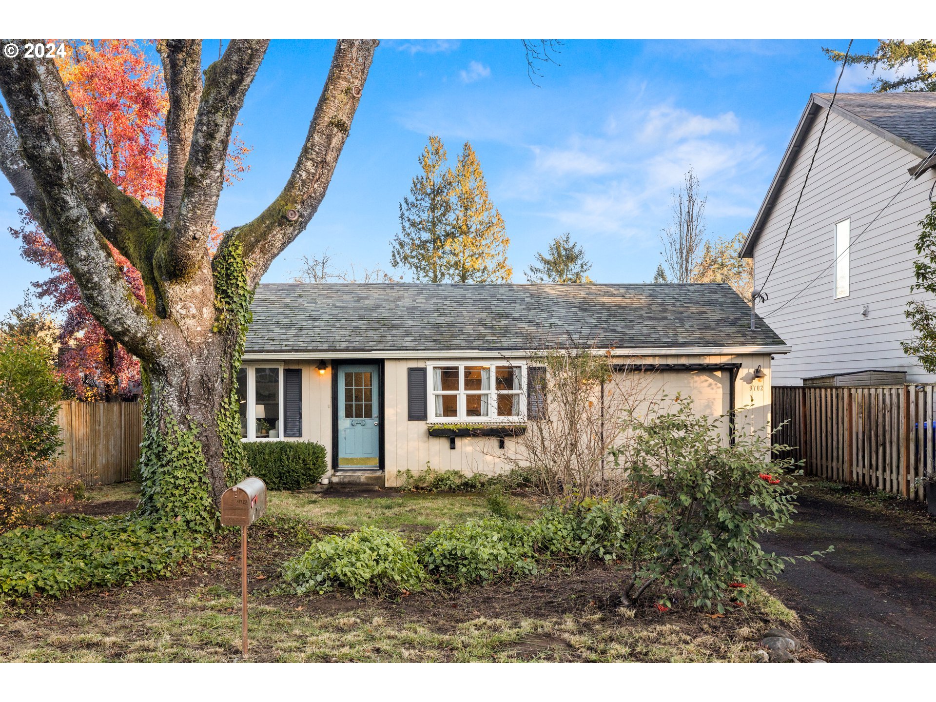 a view of house with a yard