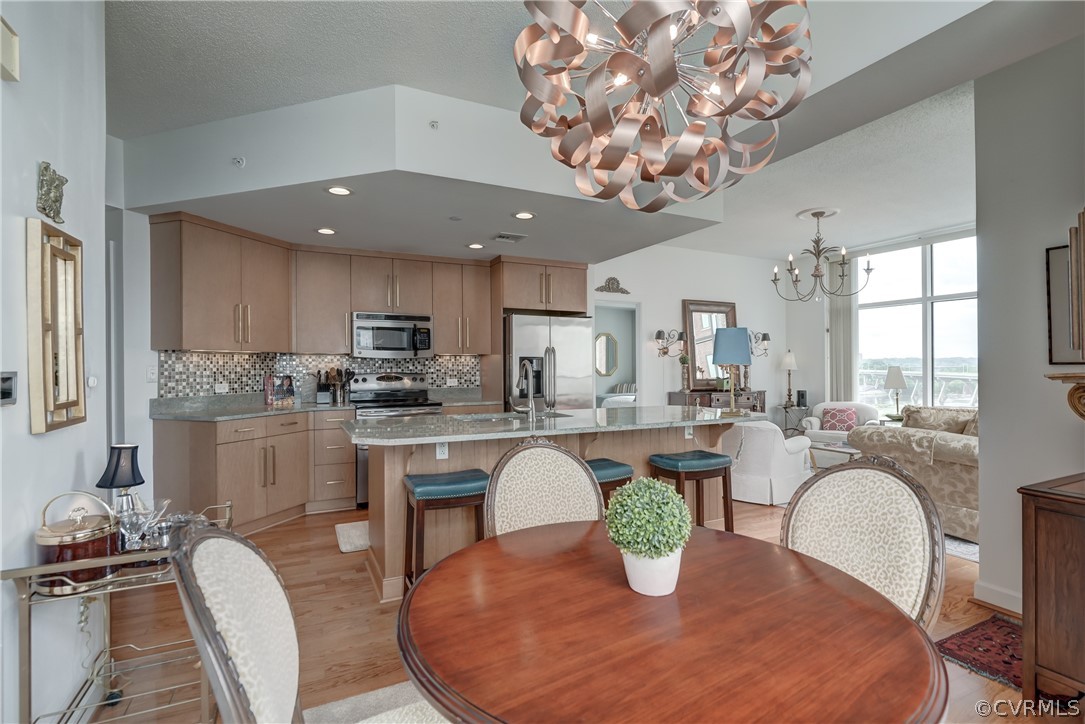 a kitchen with a table and chairs in it