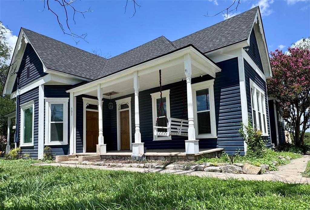 front view of a house with a yard