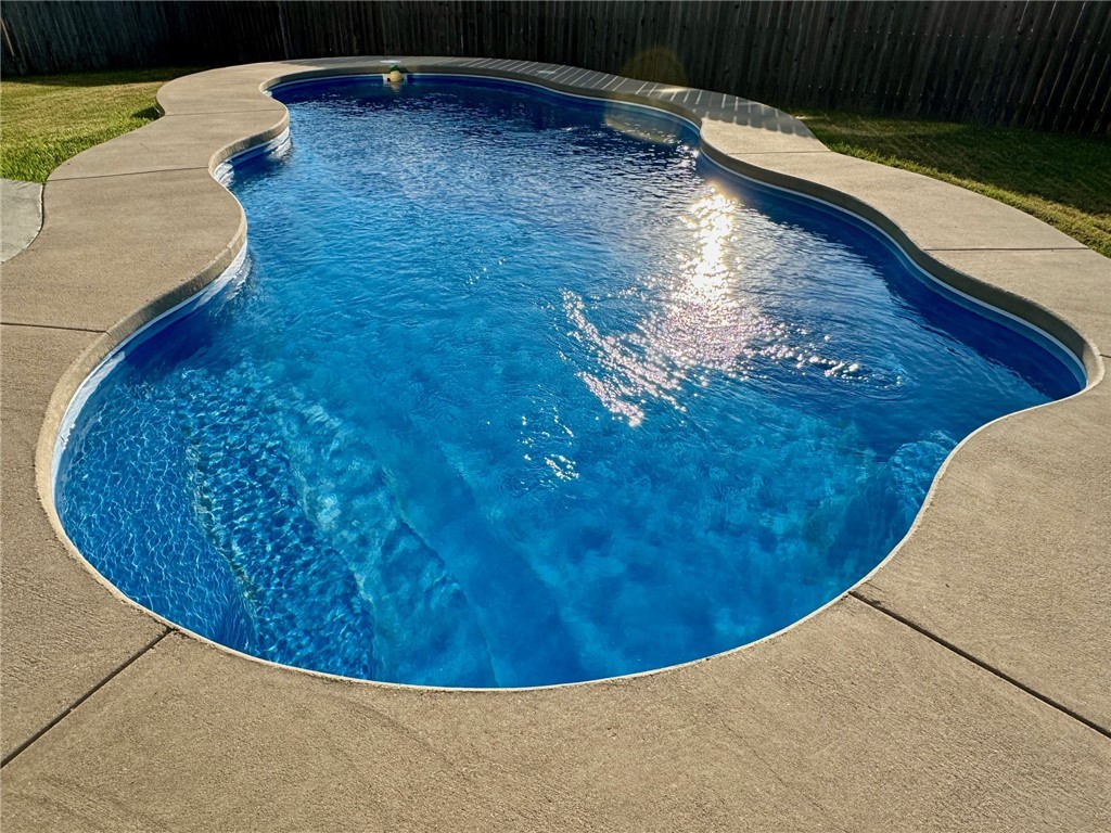 a view of a swimming pool with an outdoor space