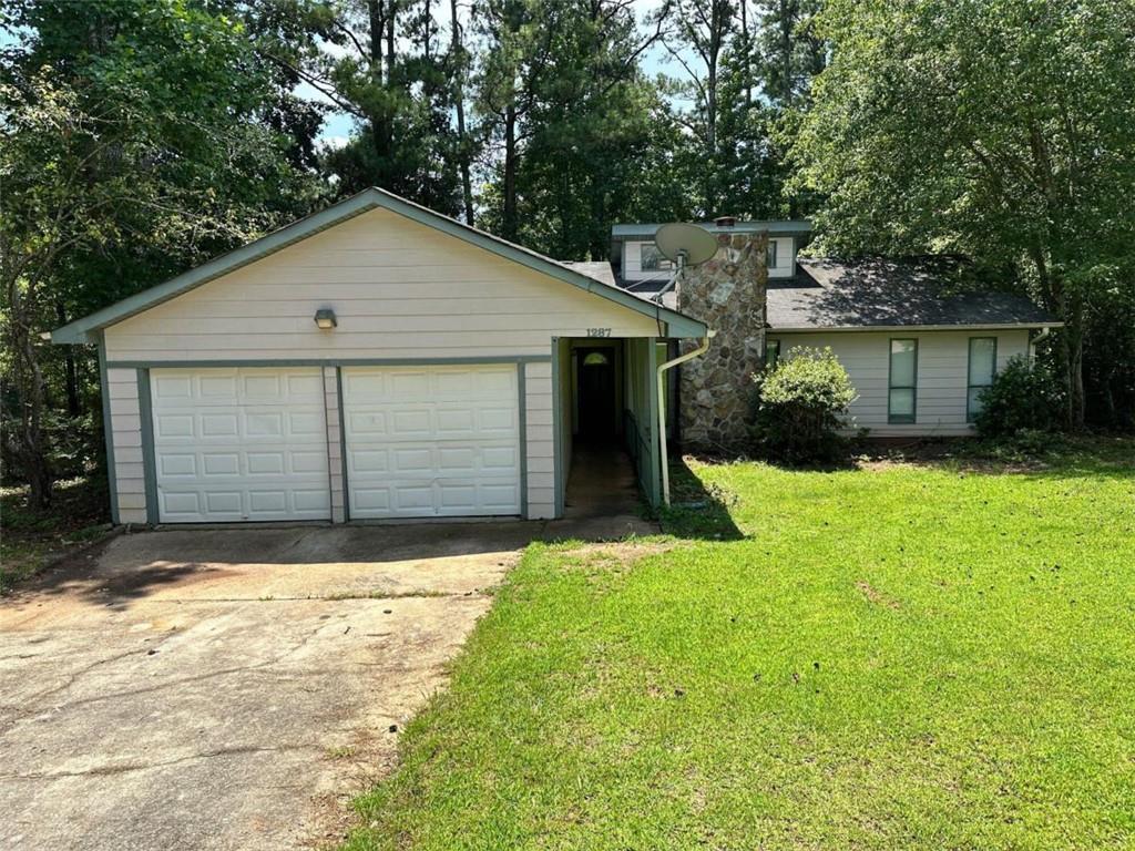 a house with tree in front of it